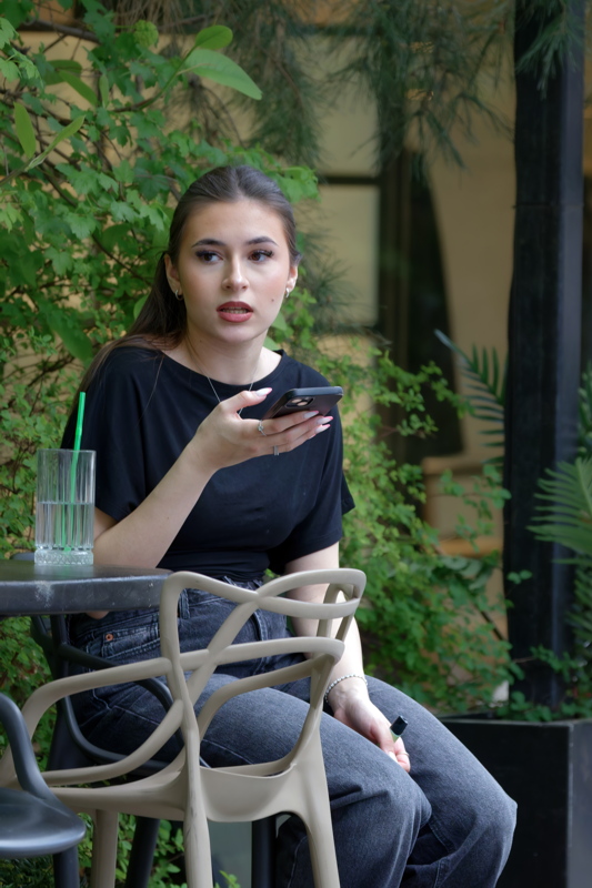 Pretty girl at a terrace table